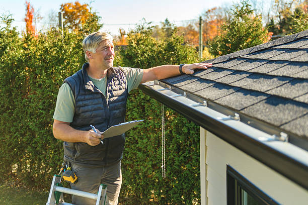 Professional Storm Damage Roof Repair technician working in Covington, TN